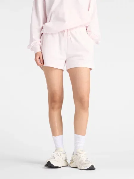 Спортивні шорти New Balance SPORT ESSENTIALS FRENCH TERRY світло-рожевий бавовна/перероблений рожеві
