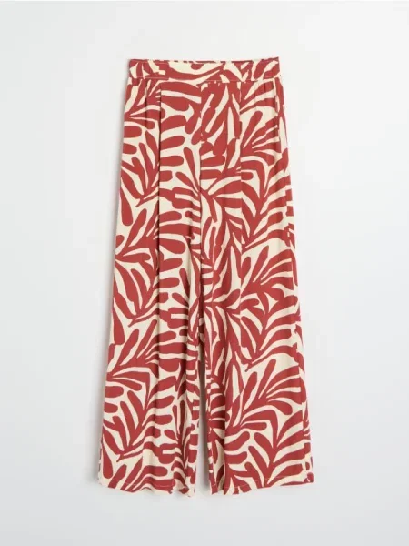 Брюки Sinsay с абстрактным узором с янтарем