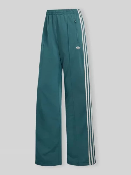 Spodnie dresowe o kroju loose fit z paskami w kontrastowym kolorze Adidas Originals