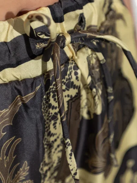 Pantaloni Ganni de mătase cu imagine galben