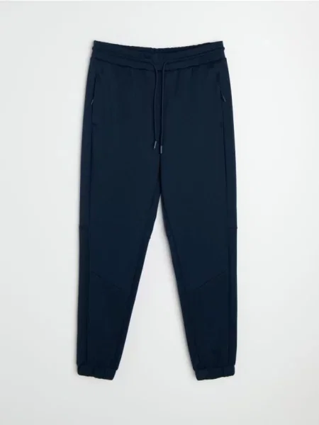 Sinsay Kalhoty tapered fit Active námořnická modrá