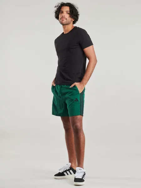 Prugaste kratke hlače Adidas zelena