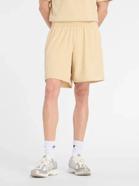 Клетчатые спортивные шорты New Balance бежевые