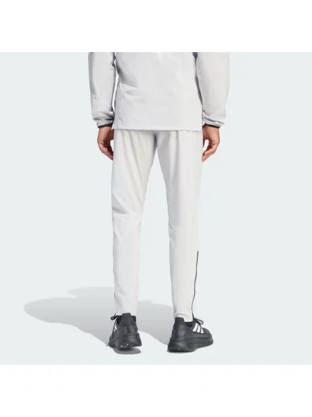 Kalhoty Tiro Travel Woven Pants černé