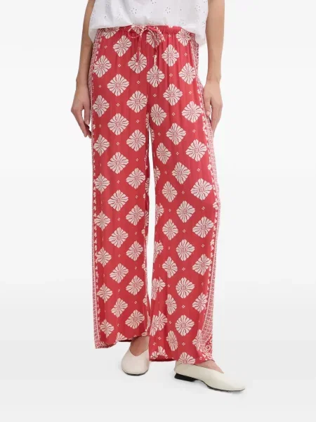 Pantaloni Rip Curl cu model floral cu imagine cu cordon roșu