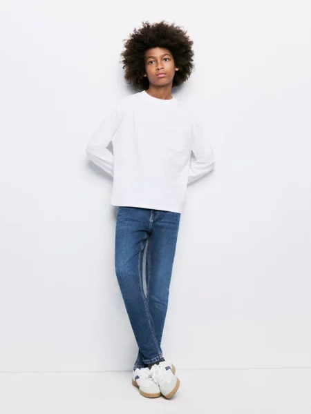 Jeansy skinny fit z bawełny Dzieci 9 MANGO KIDS ciemnoniebieski