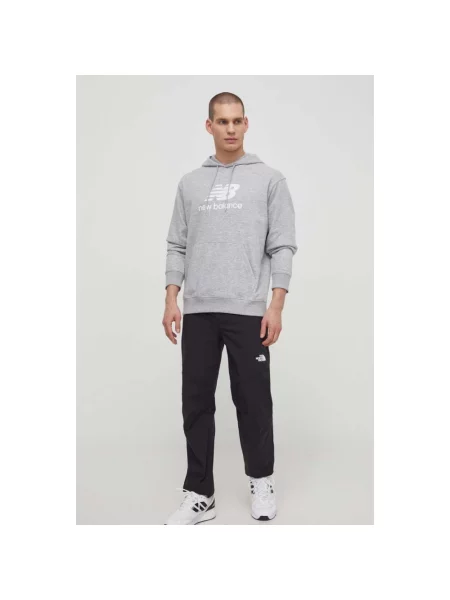 Spodnie dresowe The North Face zwężane niebieskie