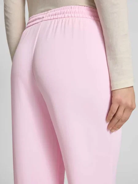 Spodnie dresowe o kroju loose fit z elastycznym pasem i troczkiem Jjxx różowy