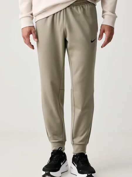 Nike spodnie treningowe Flex Therma-FIT zielone