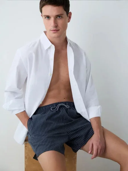 Penti Plavecké šortky PENTI Gestreifte Herren-Badeshorts námořnická modř