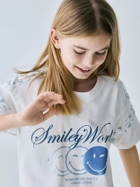 Reserved Tričko SmileyWorld® krémová