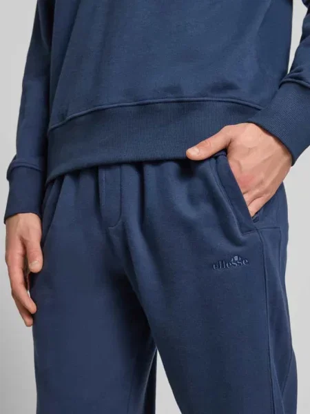Spodnie dresowe o kroju regular fit z wpuszczanymi model ‘ORVINIO’ Ellesse