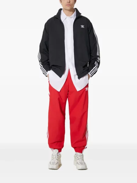 Pruhované kalhoty Adidas s výšivkou se síťovinou červené