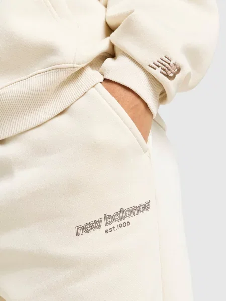 New Balance Spodnie Collegiate Cuff beżowe