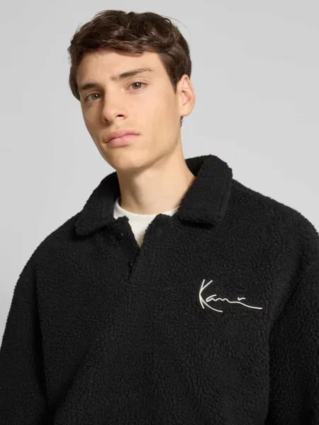 Bluza z pluszu teddy z kołnierzem wykładanym i zapięciem na Karl Kani czarna