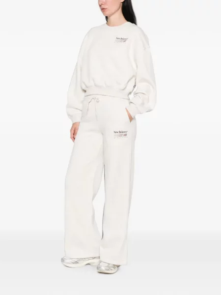 Decupat pantaloni New Balance cu imagine alergare