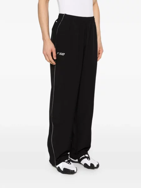 Pruhované kalhoty Adidas s potiskem černé