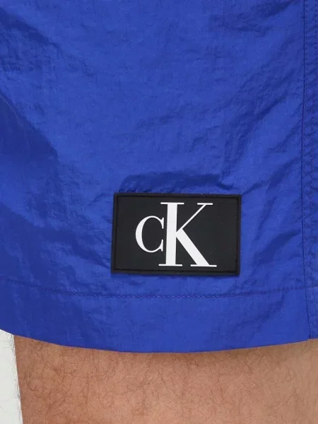 Olcsóbban. Férfi úszónadrág Calvin Klein Medium Double WB midnight lagoon. Méret: S sötétkék