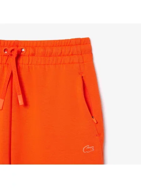 Lacoste Spodnie Zwężane pomarańczowe