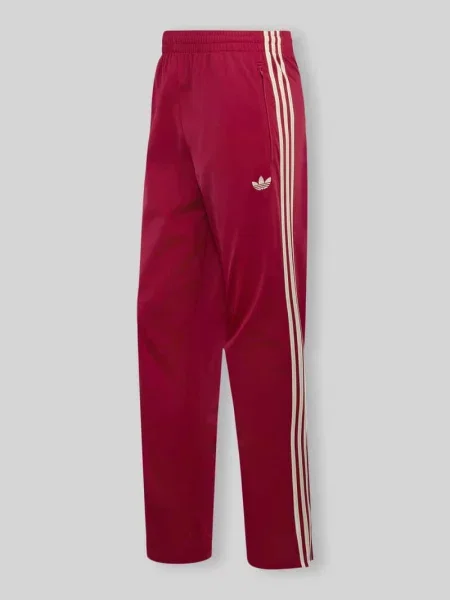 Spodnie dresowe o kroju regular fit z wyhaftowanym logo model FIREBIRD' Adidas Originals czerwone