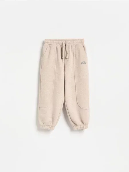 Reserved Штани jogger з бавовною бежевий