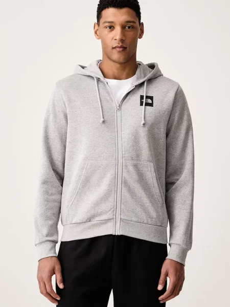 The North Face jopica s kapuco z bombažem Box Regular siva