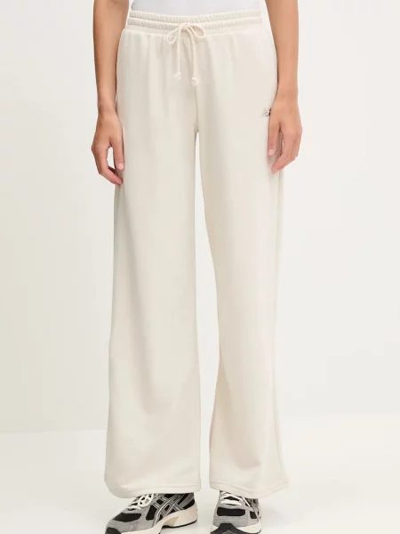 New Balance pantaloni de trening uni bej