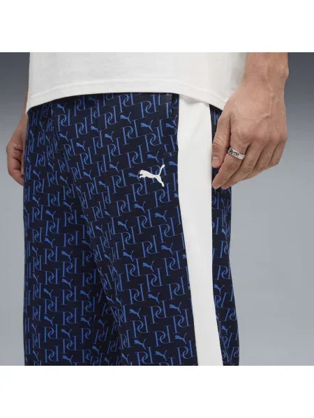 PUMA spodnie dresowe T7 o luźnym kroju z nadrukiem na całej powierzchni Akcesoria S niebieski