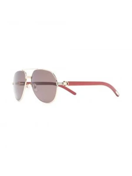 Saulės akiniai Cartier Eyewear oranžinė