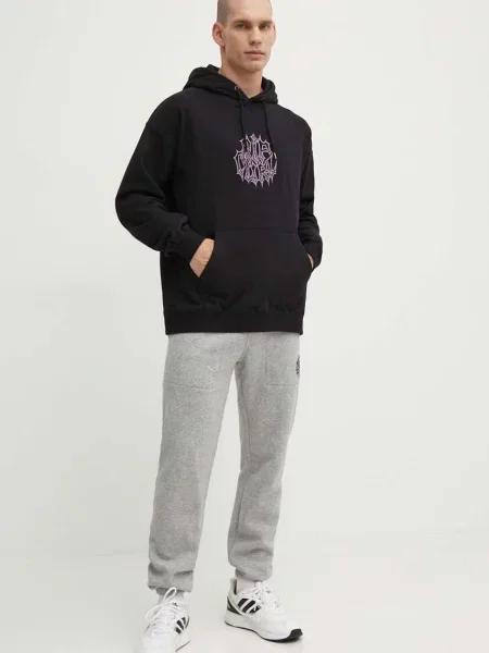 Bombažen pulover Rip Curl s kapuco črna