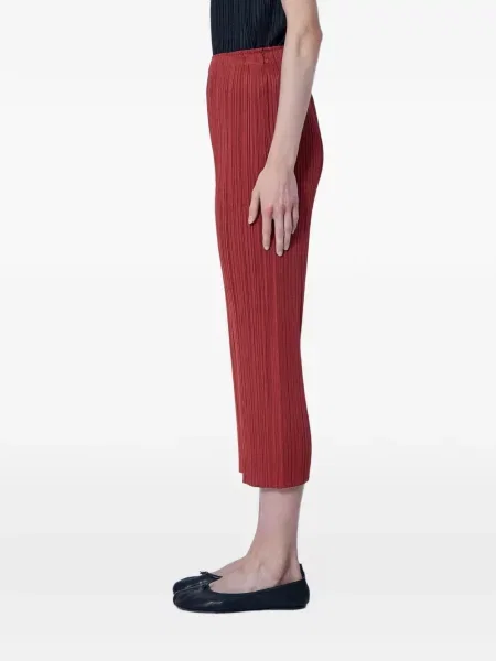 Oříznuté kalhoty Pleats Please Issey Miyake červené