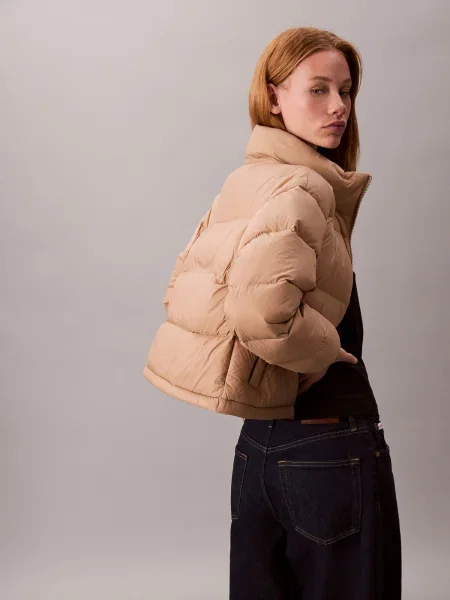 Calvin Klein Jeans Vatovaná bunda Graphic Logo béžová