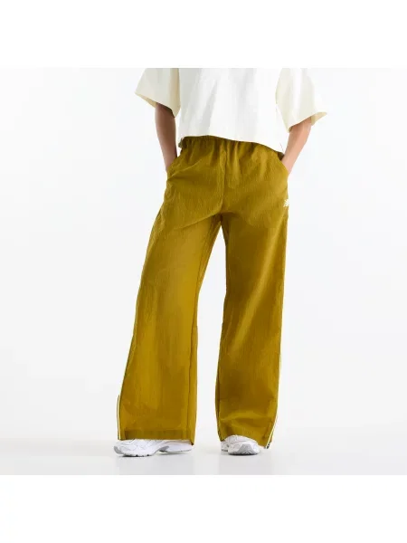 Spodnie New Balance Sport Legacy Pant Basil Oil XS żółte