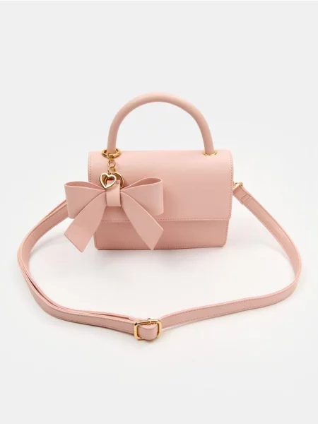 Сумка з бантом і декоративною підвіскою у формі серця пастельний рожевий