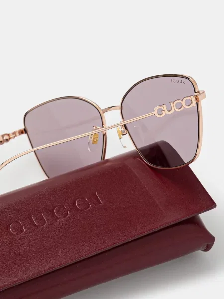 Солнцезащитные очки Gucci золотые