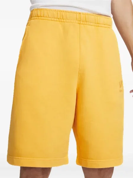 Krátké fleecové kraťasy Nike s potiskem žluté