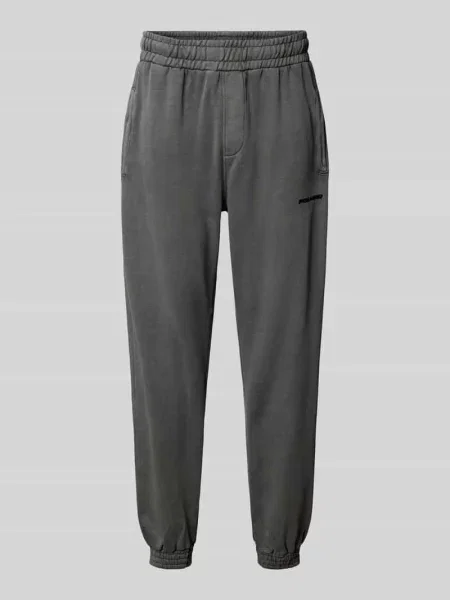 Spodnie dresowe o kroju tapered fit z wyhaftowanym logo Pegador czarny