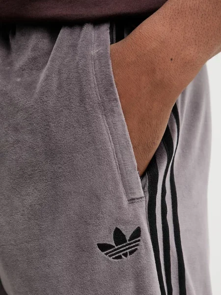 Спортивні штани adidas Originals Sst Tp з аплікацією фіолетовий