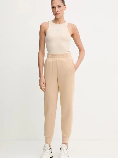 Спортивные штаны Guess с аппликацией бежевые