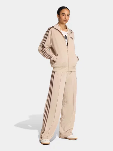 Спортивні штани adidas FIREBIRD LOOSE TRACK поліетилентерефталат коричневий