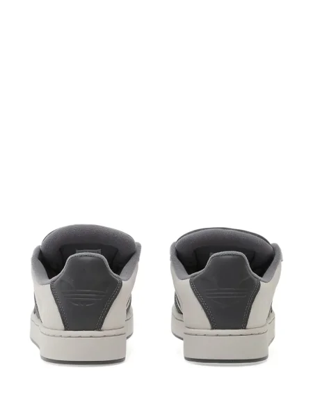 Pantaloni palazzo Adidas cu dungi cu decolteu în V negru