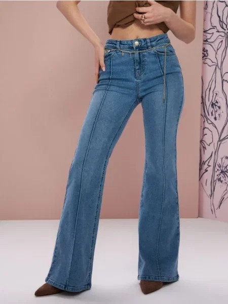 Розкльошені джинси з ефектом прання синій