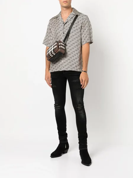 Skinny jeansy skinny Amiri z przetarciami czarne