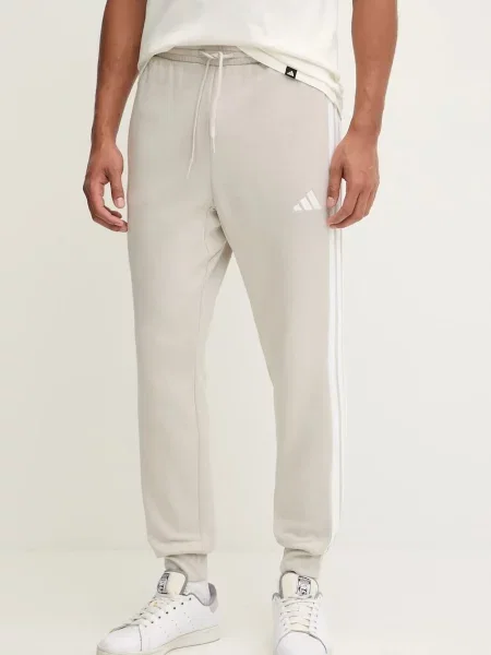 Adidas spodnie dresowe Essentials z aplikacją beżowy