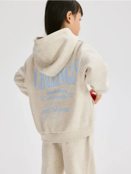 Reserved Bluză cu inscripție pe spate bej