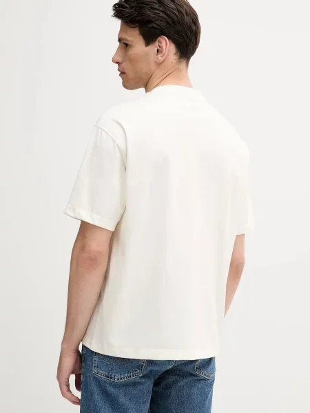 Tričko Calvin Klein Jeans s aplikací béžová