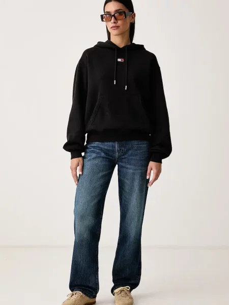 Tommy Jeans pulover s kapuco z bombažem črna