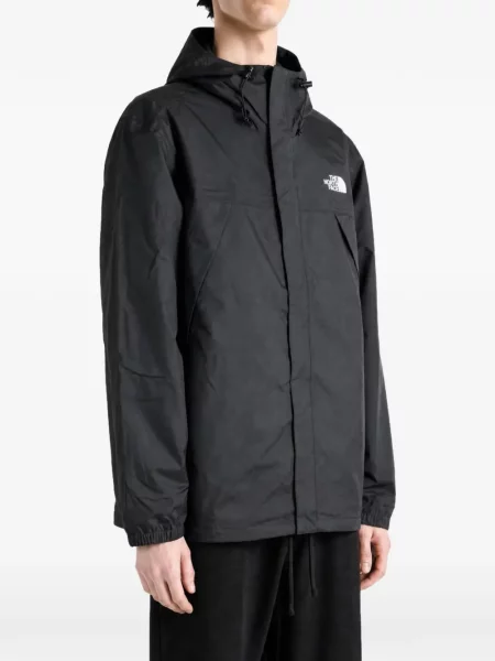 Jakna The North Face s kapuljačom s printom crna