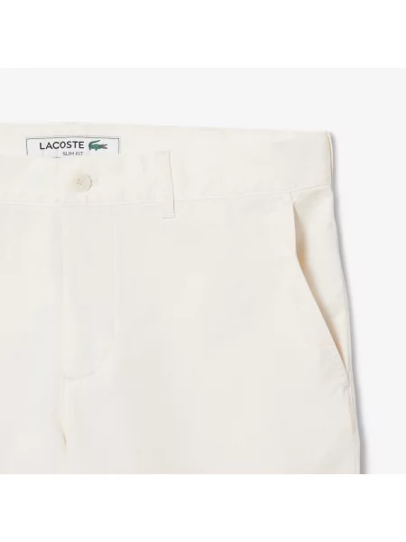 Сhinosy Lacoste białe