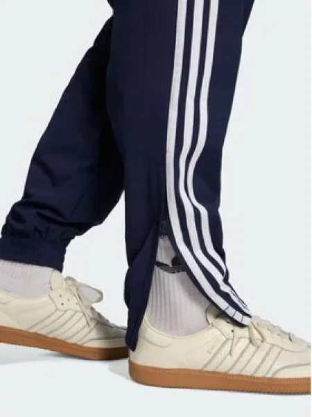 Adidas Spodnji del trenirke Firebird Woven Mornarsko modra